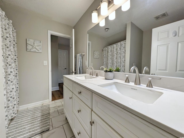 50 Pawleys Place Dr Unit 50, Pawleys Island, SC 29585 - bathroom featuring double vanity and marble finish floors