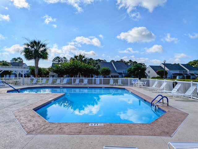 50 Pawleys Place Dr Unit 50, Pawleys Island, SC 29585 - community pool featuring a patio and a residential view