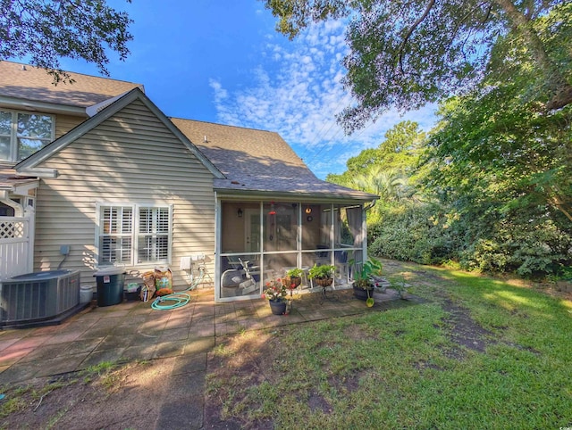 50 Pawleys Place Dr Unit 50, Pawleys Island, SC 29585 - rear view of house featuring a patio area, a shingled roof, and a sunroom