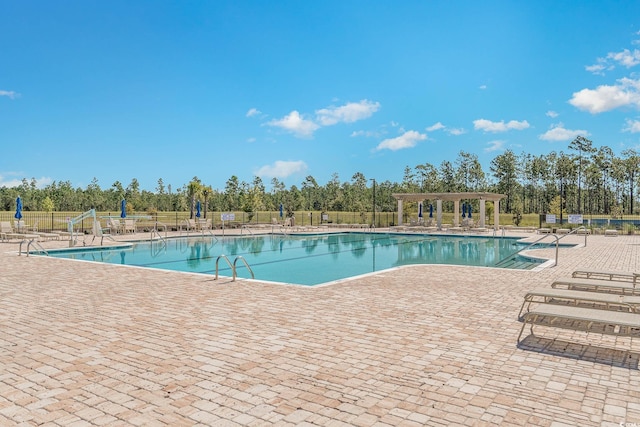 3619 White Wing Cir, Myrtle Beach, SC 29579 - community pool with a patio and view of wooded area