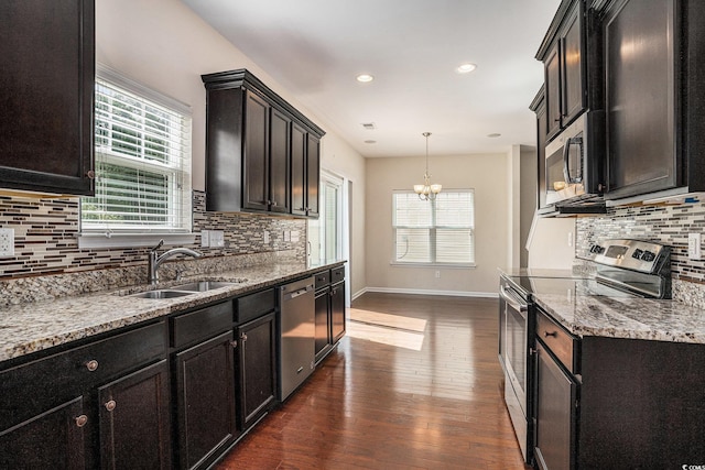 3619 White Wing Cir, Myrtle Beach, SC 29579 - kitchen with appliances with stainless steel finishes, dark wood finished floors, backsplash, plenty of natural light, and recessed lighting