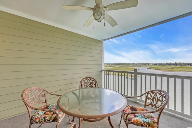 312 42nd Ave N Unit B2, North Myrtle Beach, SC 29582 - balcony with ceiling fan, outdoor dining area, a water view, and view of golf course