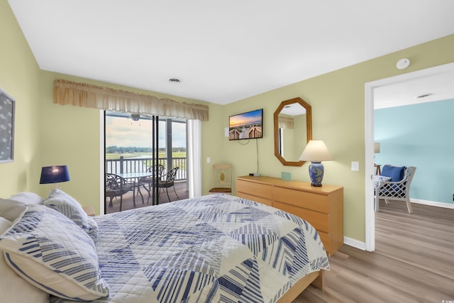 312 42nd Ave N Unit B2, North Myrtle Beach, SC 29582 - bedroom with access to outside and light wood-type flooring