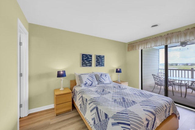 312 42nd Ave N Unit B2, North Myrtle Beach, SC 29582 - bedroom featuring access to outside and wood finished floors