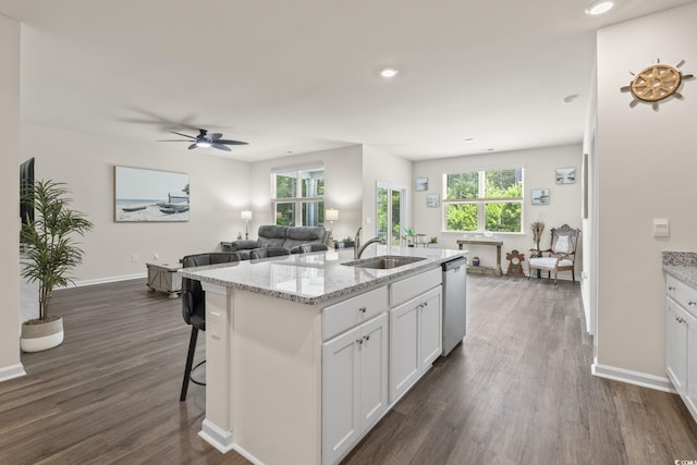 688 Wallace Dr, Little River, SC 29566 - kitchen featuring stainless steel dishwasher, dark wood-style floors, white cabinets, light stone counters, and recessed lighting