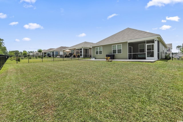 688 Wallace Dr, Little River, SC 29566 - rear view of property featuring a sunroom and a fenced backyard
