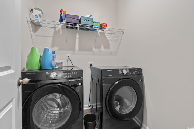 688 Wallace Dr, Little River, SC 29566 - laundry area featuring washing machine and dryer and baseboards