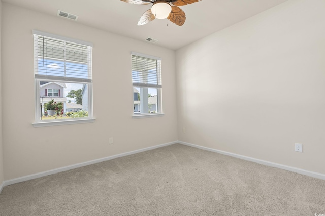 688 Wallace Dr, Little River, SC 29566 - spare room with light colored carpet and a ceiling fan
