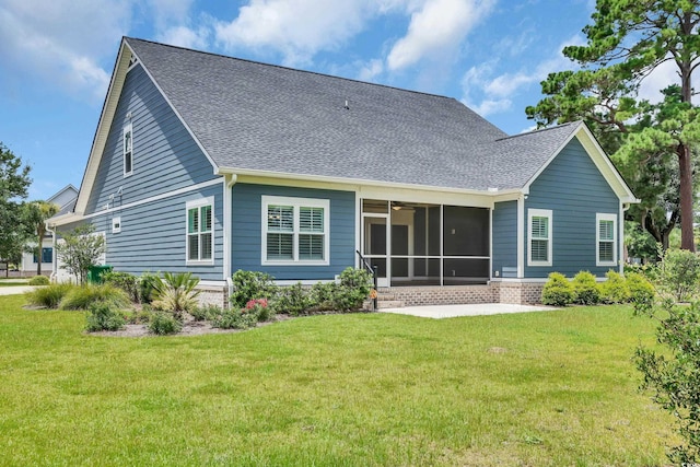 529 Oak Lawn Rd, Georgetown, SC 29440 - rear view of property featuring a sunroom, a yard, a patio area, and roof with shingles