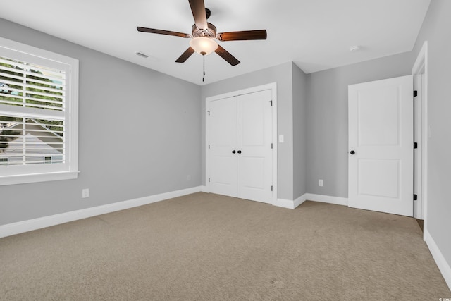 529 Oak Lawn Rd, Georgetown, SC 29440 - unfurnished bedroom with carpet floors, a closet, and a ceiling fan