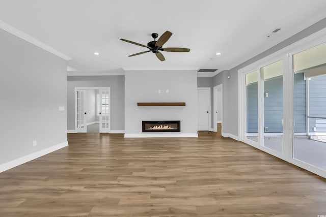 529 Oak Lawn Rd, Georgetown, SC 29440 - unfurnished living room featuring ornamental molding, a ceiling fan, wood finished floors, recessed lighting, and a glass covered fireplace