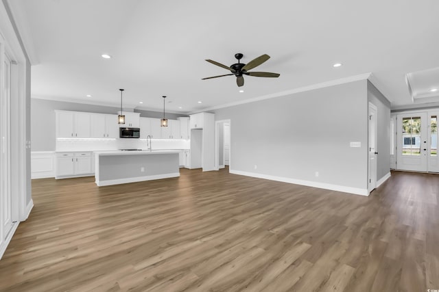 529 Oak Lawn Rd, Georgetown, SC 29440 - unfurnished living room featuring recessed lighting, wood finished floors, ceiling fan, and ornamental molding