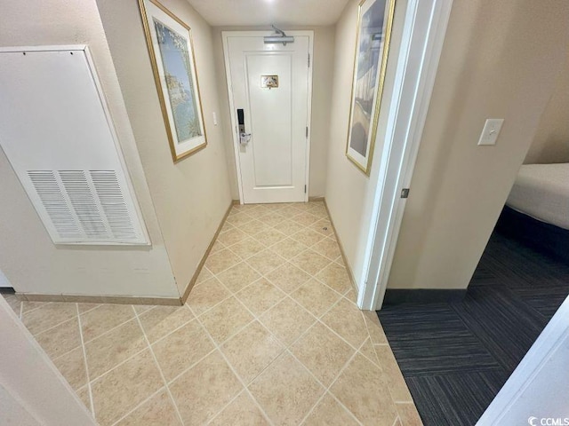 300 N Ocean Blvd Unit 1213, North Myrtle Beach, SC 29582 - hall featuring baseboards and tile patterned floors
