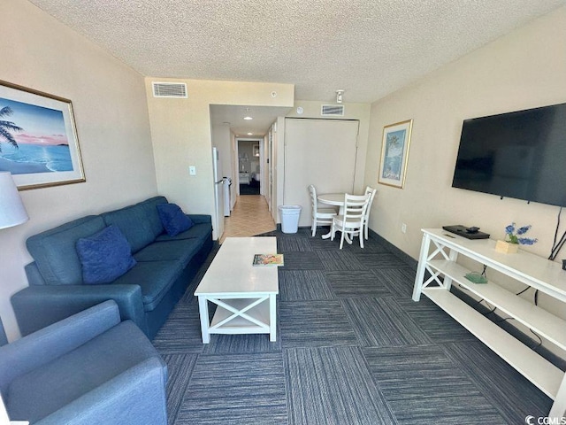 300 N Ocean Blvd Unit 1213, North Myrtle Beach, SC 29582 - carpeted living room featuring a textured ceiling