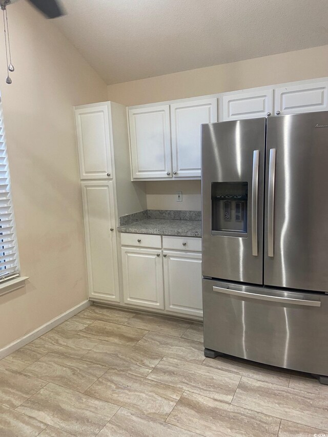 110 Palisade Loop Unit 110, Pawleys Island, SC 29585 - kitchen with stainless steel fridge with ice dispenser and white cabinetry