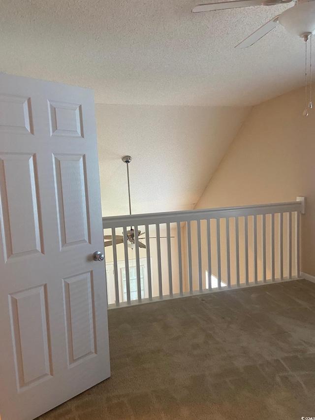 110 Palisade Loop Unit 110, Pawleys Island, SC 29585 - hall featuring carpet floors, a textured ceiling, and vaulted ceiling