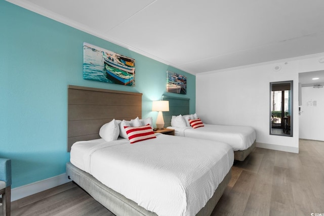 2311 S Ocean Blvd Unit 143, Myrtle Beach, SC 29577 - bedroom with crown molding and wood finished floors