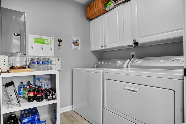 139 Butkus Dr Unit 3, Myrtle Beach, SC 29588 - laundry area with washing machine and dryer, cabinet space, electric panel, and light wood-type flooring