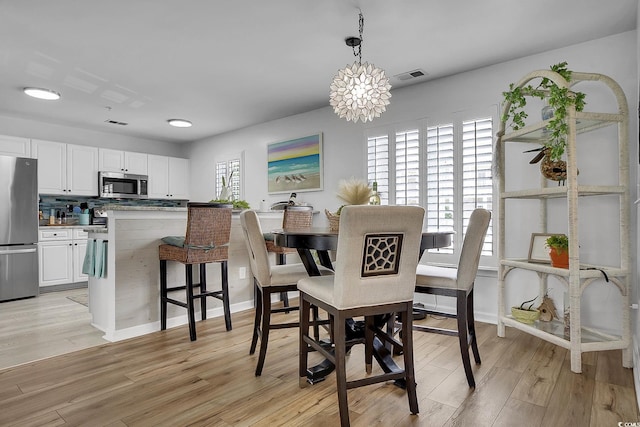 139 Butkus Dr Unit 3, Myrtle Beach, SC 29588 - dining area with light wood-style flooring and baseboards