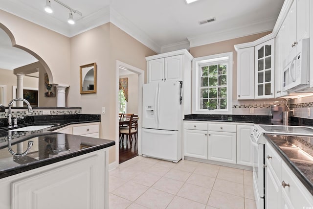 4495 Trotters Ct, Murrells Inlet, SC 29576 - kitchen with white appliances, ornamental molding, ornate columns, tasteful backsplash, and arched walkways
