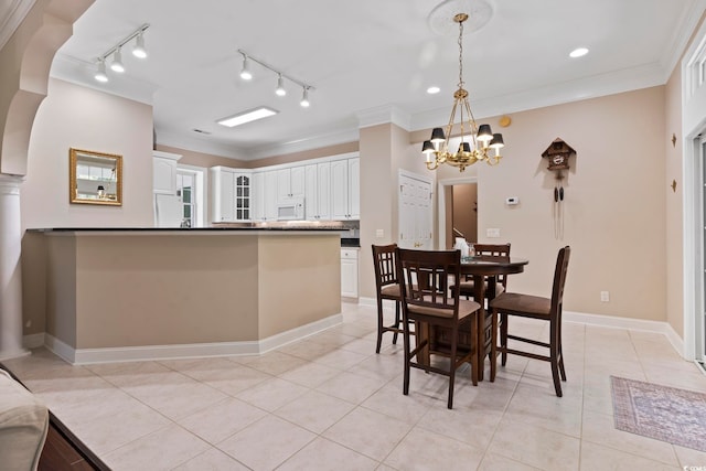 4495 Trotters Ct, Murrells Inlet, SC 29576 - dining room featuring a chandelier, light tile patterned floors, crown molding, and track lighting