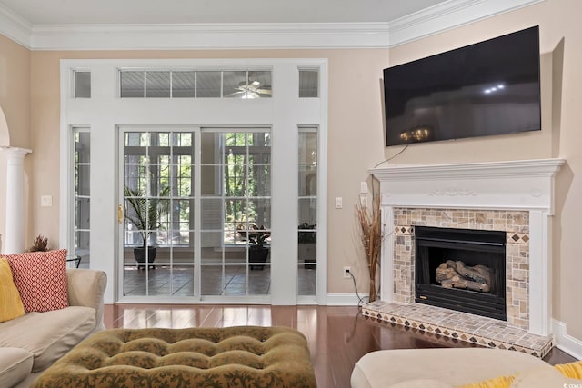 4495 Trotters Ct, Murrells Inlet, SC 29576 - living area featuring wood finished floors, a brick fireplace, ceiling fan, and crown molding