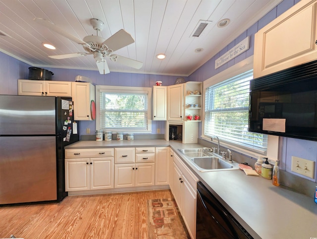206 Atlantic Ave, Pawleys Island, SC 29585 - kitchen featuring freestanding refrigerator, plenty of natural light, light wood-style floors, dishwasher, and recessed lighting