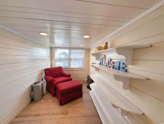 206 Atlantic Ave, Pawleys Island, SC 29585 - living area featuring wood finished floors, wooden walls, and recessed lighting
