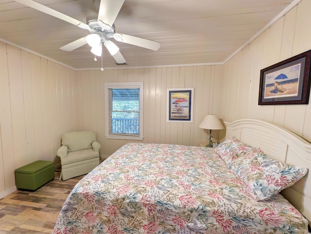 206 Atlantic Ave, Pawleys Island, SC 29585 - bedroom with wood finished floors, ornamental molding, and ceiling fan
