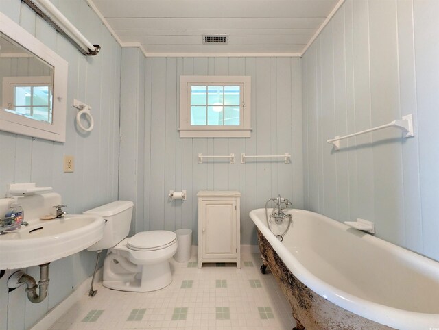 206 Atlantic Ave, Pawleys Island, SC 29585 - bathroom with a soaking tub and tile patterned flooring