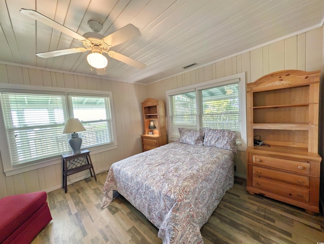 206 Atlantic Ave, Pawleys Island, SC 29585 - bedroom featuring multiple windows, wood finished floors, wooden ceiling, wood walls, and a ceiling fan