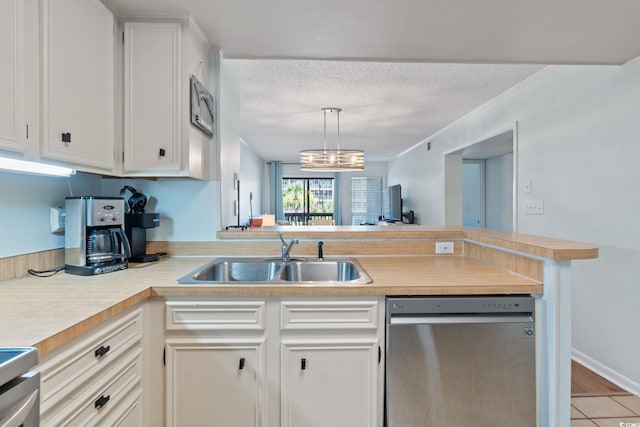 212 N 2nd Ave N Unit 162, North Myrtle Beach, SC 29582 - kitchen with dishwasher, a peninsula, light countertops, white cabinetry, and range