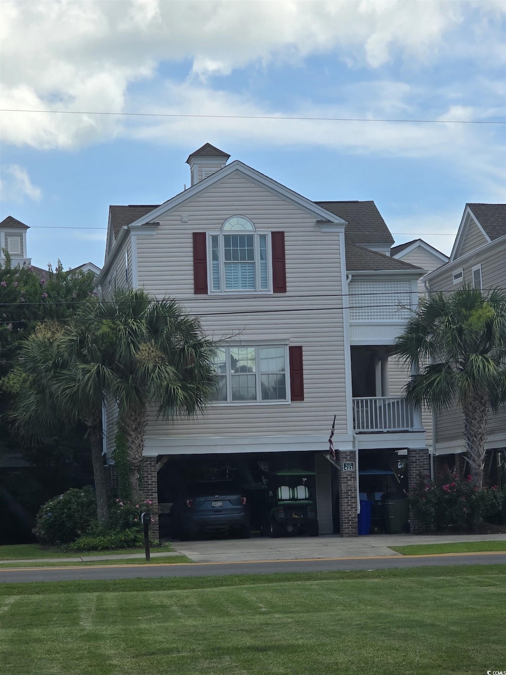 422 S 3rd Ave, Surfside Beach, SC 29575 - view of front of house featuring a front lawn