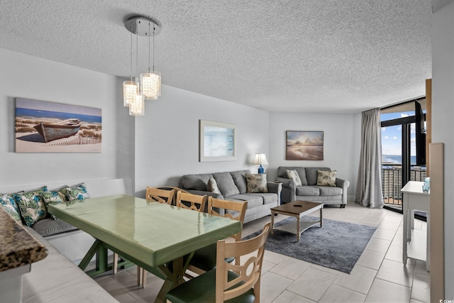 205 74th Ave N Unit 1809, Myrtle Beach, SC 29572 - dining space featuring a textured ceiling, a chandelier, and light tile patterned floors