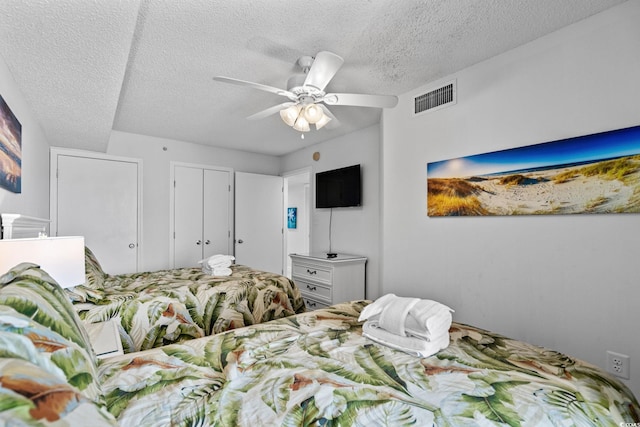 205 74th Ave N Unit 1809, Myrtle Beach, SC 29572 - bedroom featuring a textured ceiling and ceiling fan