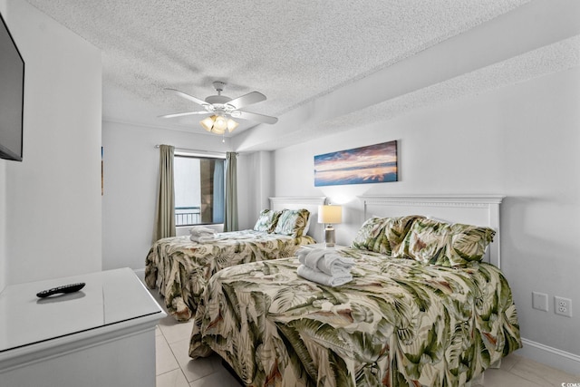 205 74th Ave N Unit 1809, Myrtle Beach, SC 29572 - bedroom featuring a textured ceiling, light tile patterned flooring, and ceiling fan