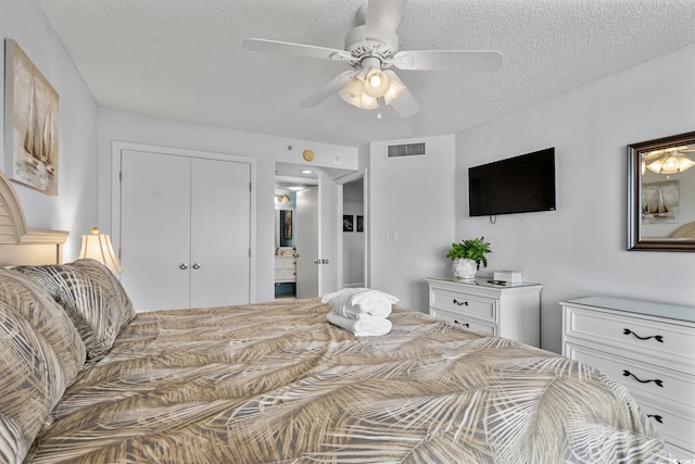205 74th Ave N Unit 1809, Myrtle Beach, SC 29572 - bedroom featuring a closet, a ceiling fan, and a textured ceiling