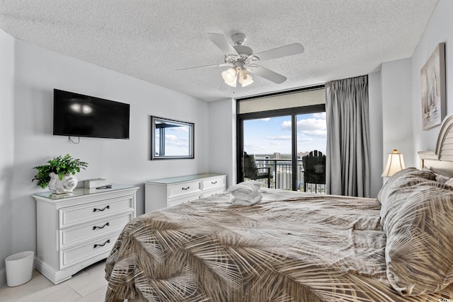 205 74th Ave N Unit 1809, Myrtle Beach, SC 29572 - bedroom with access to exterior, a textured ceiling, and ceiling fan