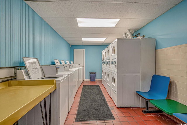 205 74th Ave N Unit 1809, Myrtle Beach, SC 29572 - shared laundry featuring washer and dryer, light tile patterned floors, and estacked washer and dryer