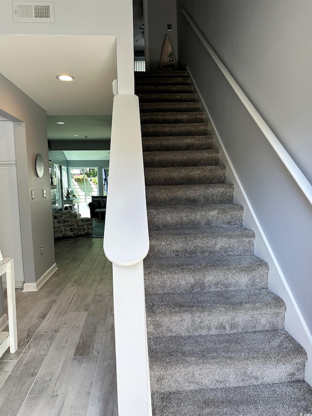 435 Ocean Creek Dr Unit 2731, Myrtle Beach, SC 29572 - staircase featuring wood finished floors and recessed lighting