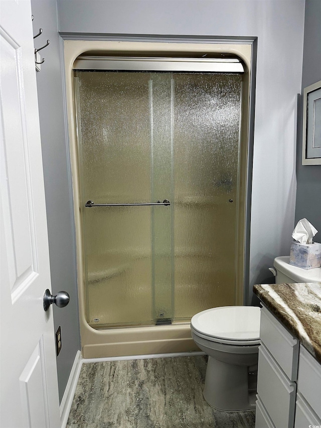 435 Ocean Creek Dr Unit 2731, Myrtle Beach, SC 29572 - bathroom with vanity, a stall shower, and wood finished floors