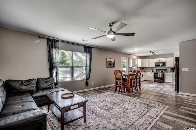 780 Trap Shooter Cir, Longs, SC 29568 - living room featuring dark wood-type flooring and a ceiling fan