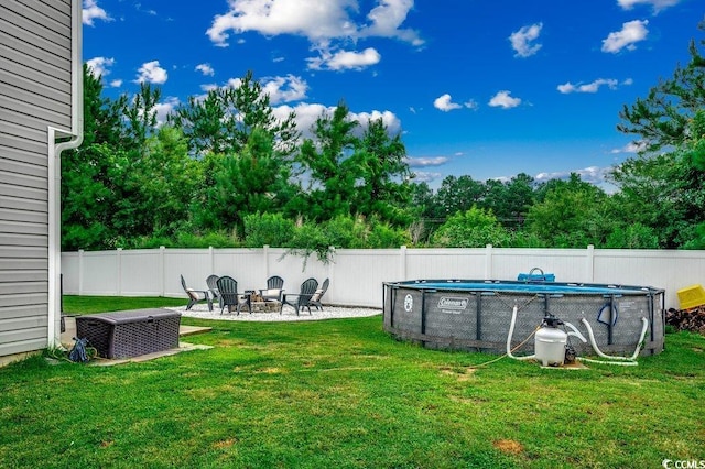780 Trap Shooter Cir, Longs, SC 29568 - fenced backyard with a fire pit