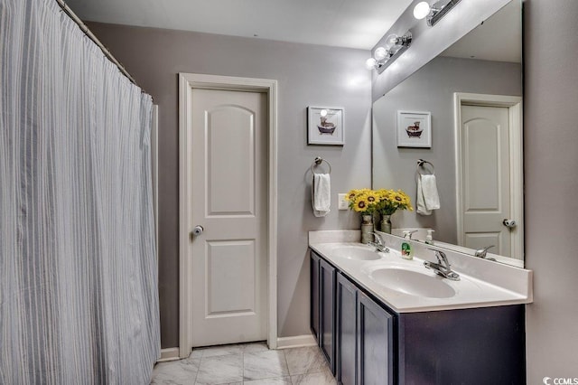 780 Trap Shooter Cir, Longs, SC 29568 - bathroom featuring double vanity and marble look tile flooring
