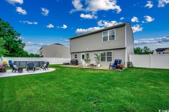 780 Trap Shooter Cir, Longs, SC 29568 - rear view of property featuring an outdoor fire pit, a patio area, and a fenced backyard