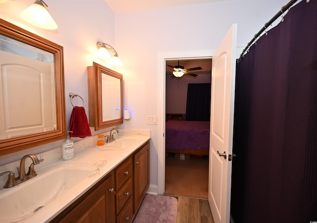 205 Cupola Dr, Longs, SC 29568 - bathroom with double vanity, ensuite bath, wood finished floors, a ceiling fan, and a shower with curtain