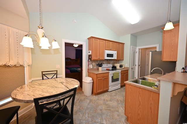 205 Cupola Dr, Longs, SC 29568 - kitchen featuring white appliances, vaulted ceiling, tasteful backsplash, a chandelier, and decorative light fixtures