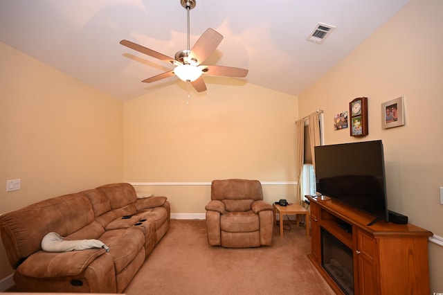 205 Cupola Dr, Longs, SC 29568 - living room with vaulted ceiling, ceiling fan, light carpet, and a glass covered fireplace