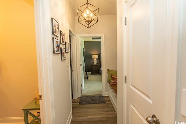 2429 Campton Loop, Conway, SC 29527 - corridor with dark wood-type flooring and a chandelier