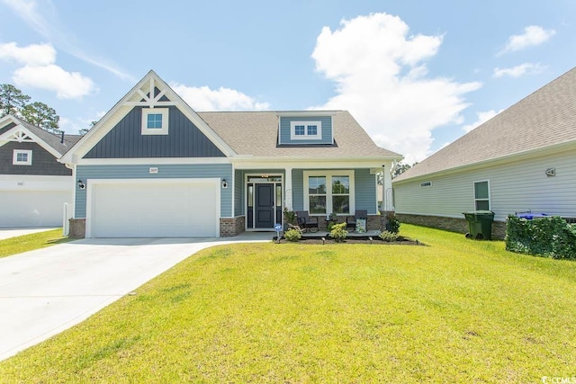 2429 Campton Loop, Conway, SC 29527 - craftsman house featuring covered porch, a front lawn, driveway, board and batten siding, and a garage